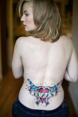 Two Guns Tattoo Design on Lower Back Girl