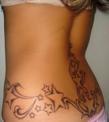 tribal tattoos, lower back tattoo, cross tattoos, star tattoo,