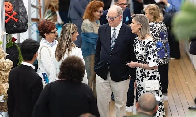 Princess Caroline wore a Kora floral-print faille maxi dress by Emilia Wicksead. Pearl earrings and Chanel white leather bag