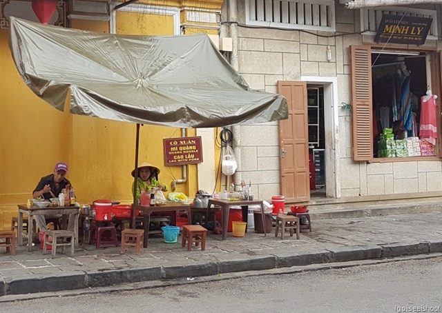 Street vendors in Hoi An. A common sight. A roadside stall selling the Cao Lao noodles, only found in Hoi An.