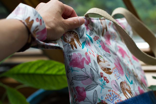 Sloth-patterned project bag has a side wrist strap.