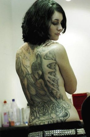 girl showing a sexy full body tattoo designs on her back