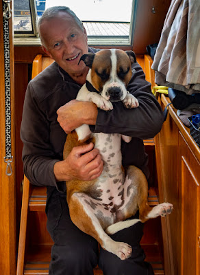 Photo of Ruby sitting on Phil's knee for a cuddle