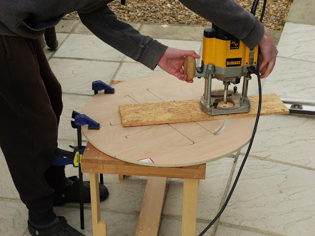 The holes were then cut using a router, with a simple guide from OSB used to create a set arc.