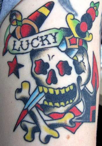 Skull and dagger with crossbones tattoo