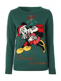 green jumper with Micky Mouse on it