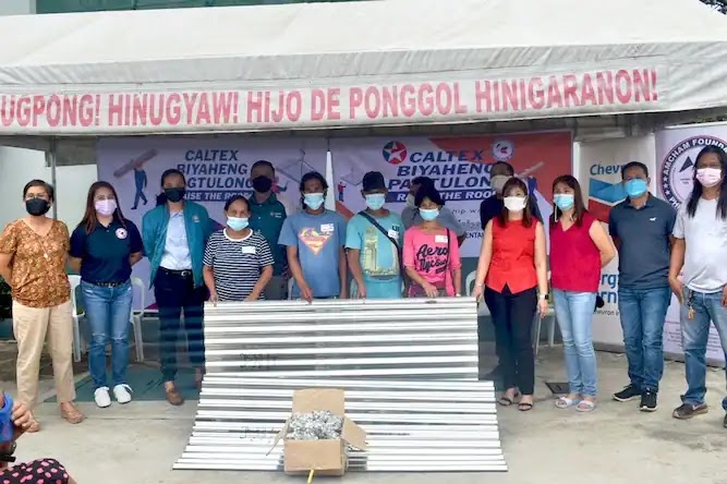 Caltex representatives with the donation beneficiaries in Municipality of Hinigaran, Negros Occidental