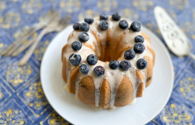 Food Lust People Love: This peach blueberry pound cake batter is made with pureed peach, and blueberries folded through, before baking to a rich, buttery finish. Top it with peach puree glaze and more blueberries for a wonderful seasonal dessert everyone will love.