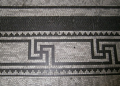 Black swastikas in a mosaic pattern in the floor of Brisbane City Hall.