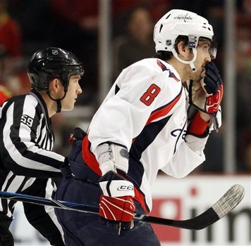 Ovechkin hit on Brian Campbell. Referee escorts away.