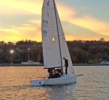 J/70 sailing on Thames River in front of US Coast Guard Academy