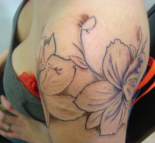 hibiscus flower tattoo on hip