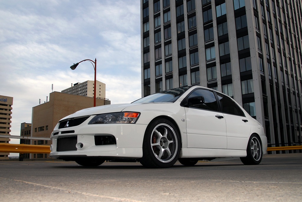 Stock Lancer EVO IX with hot Advan RG rims White rims on white EVO 