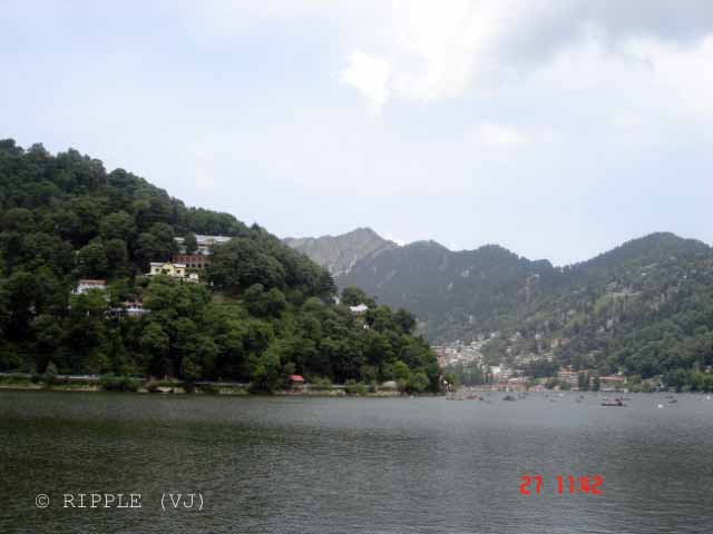 Naini Lake @ Uttrakhand, INDIA: Posted by VJ on PHOTO JOURNEY @ www.travellingcamera.com : VJ, ripple, Vijay Kumar Sharma, ripple4photography, Frozen Moments, photographs, Photography, ripple (VJ), VJ, Ripple (VJ) Photography, VJ-Photography, Capture Present for Future, Freeze Present for Future, ripple (VJ) Photographs , VJ Photographs, Ripple (VJ) Photography, Naianitaal, Uttranahcal. Uttrakhand, INDIA, People, North India : 
Naini Lake obtains flows from various sourcs which consist of the hill slopes and springs. This captivating lake is a major tourist spot in Nainital as it provides tourists with opportunities of boating and yachting. There are many mythological stories related to this lake.