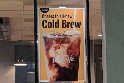 McDonald's Cold Brew coffee poster outside.