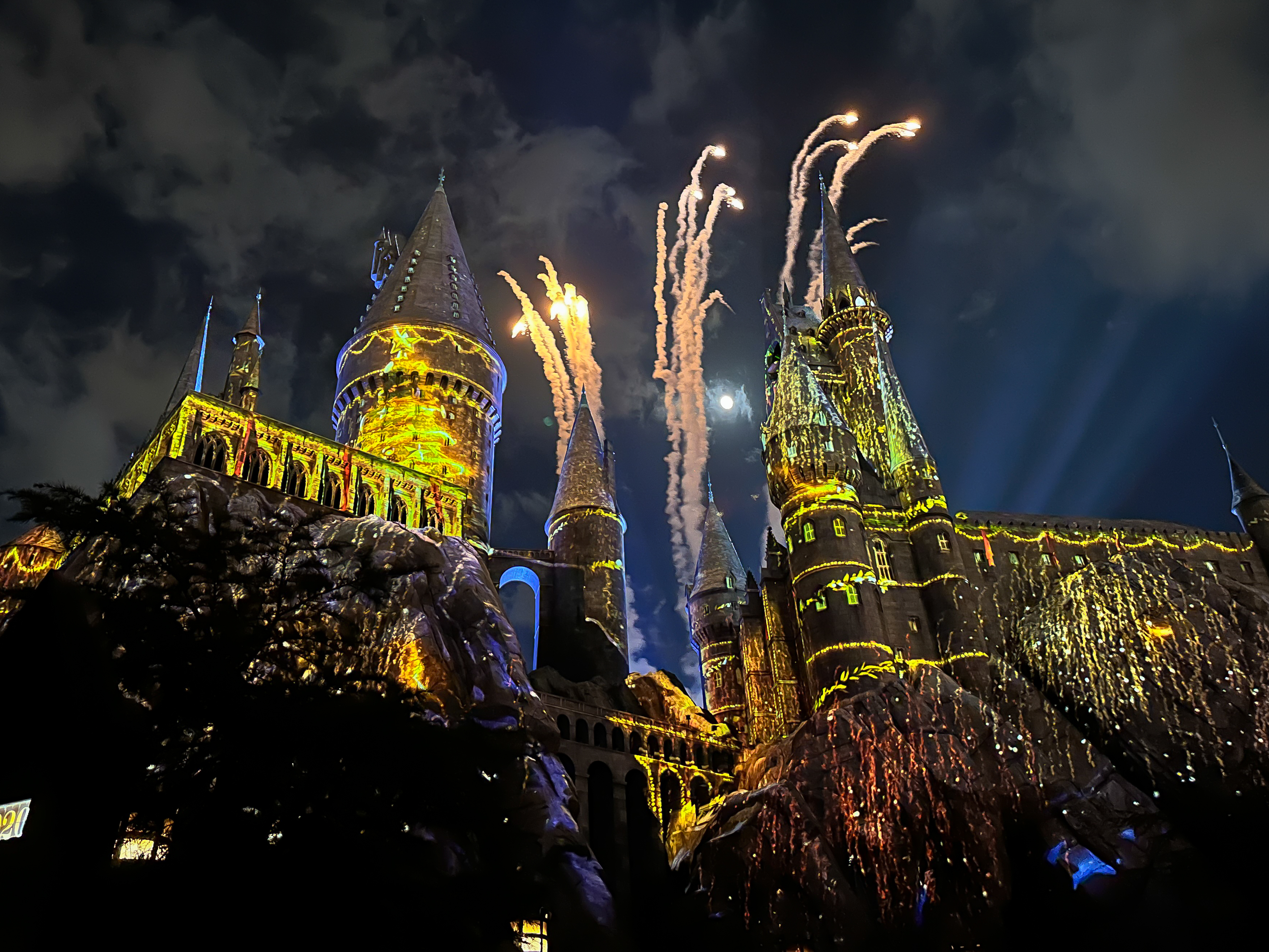 Hogwarts Castle at night during the Christmas lIght show with Fireworks