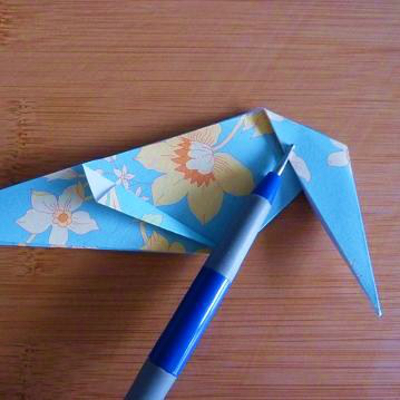 Folding the heel section of the origami paper shoe design