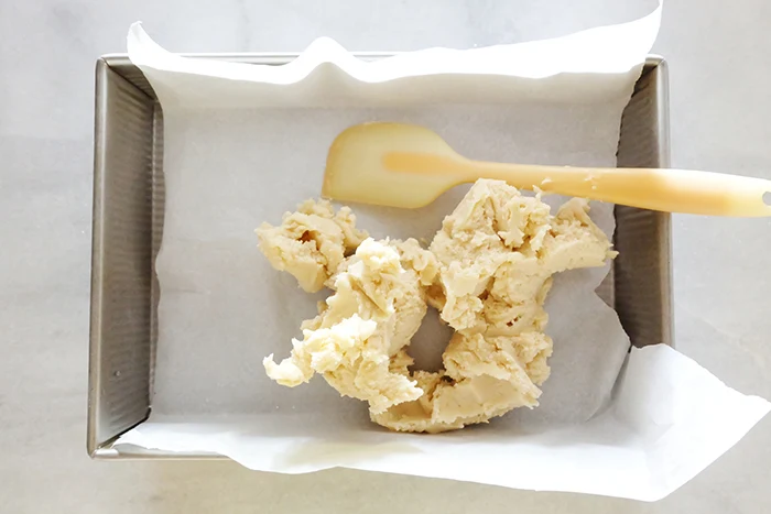 shortbread dough in pan about to spread