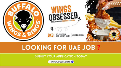 Buffalo Wings and Rings Dubai Job Openings - Energetic staff creating delicious dishes in a dynamic restaurant setting