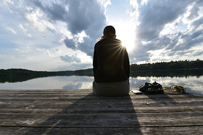 Sonya Richmond sitting at Sharbot Lake, K&P Trail