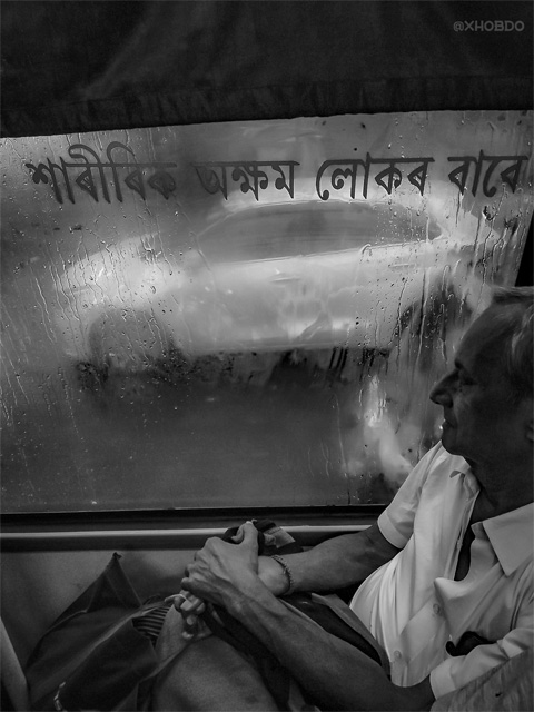 Old Man Sitting In City Bus on a rainy day