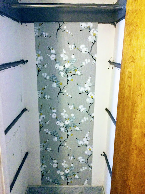 wallpapering closet with gray