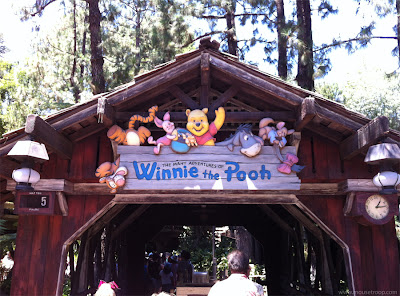 Winnie Pooh ride Disneyland entry sign entrance covered bridge