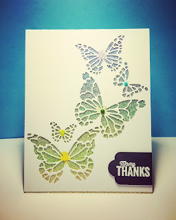 Memory Box butterfly die on top of Copic colored glitter paper.  Nuvo Jewel Drops onto center of butterfly body (same color as stamped round body) following the background color of the glitter paper.  Sentiment (white embossed) and die cut banner from Stampin' Up!  Simple but eye catching design.