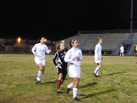 Danielle, Amanda  and Meagan prepare for the throw in