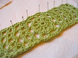 julie cuff photo in blocking process in green crochet thread