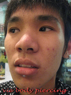 He is from Kelantan as told , done labret piercing and Industrial piercing 