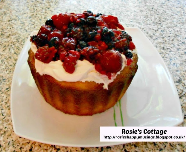 Giant Cupcake - Gently spoon on first your whipped cream and then your mixed berries