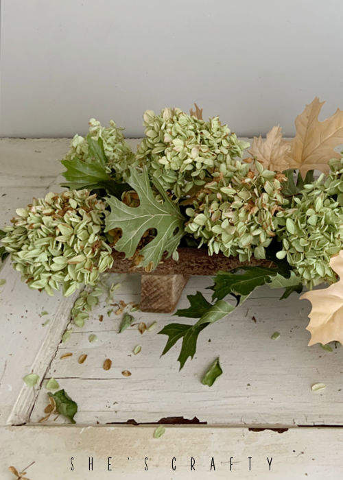 Use dried hydrangeas in metal chicken feeder.