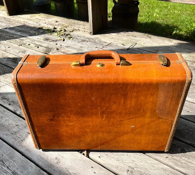 Photo of a hard body vintage suitcase.