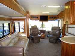 Front cockpit and sofa in main living area.