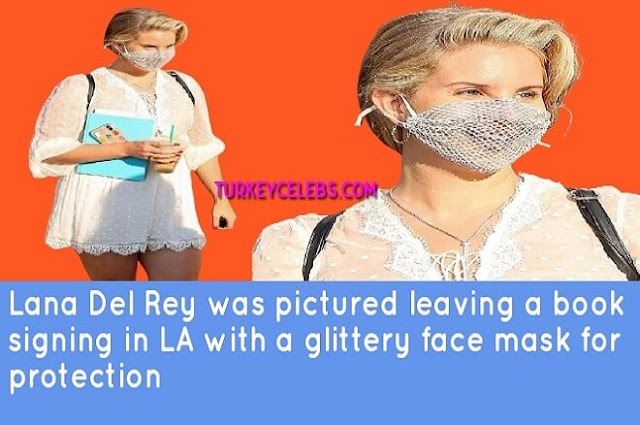 Lana Del Rey was pictured leaving a book signing in LA with a glittery face mask .