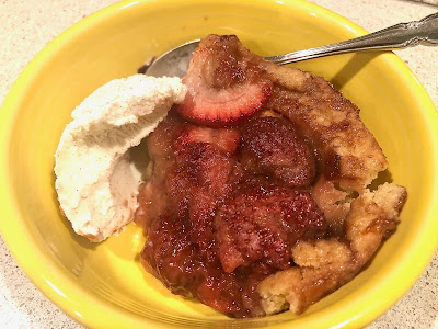 Bowl with spoon cake and ice cream