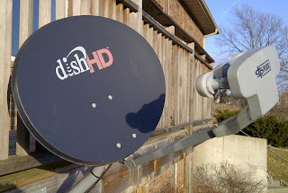 Dish Network satellite dish installed on wood deck