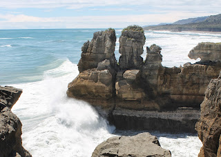 Dolomite Point at Tasman sea, New Zealand Waves breaking on the dolomite point cliffs