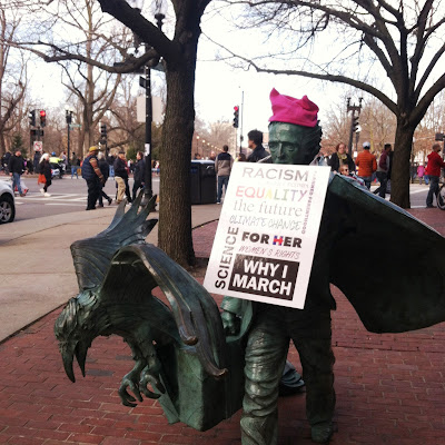 Edgar Allan Poe Statue wearing protest sign and pussy hat at the entrance to the Boston Common for the  Boston Women's March, January 21, 2017