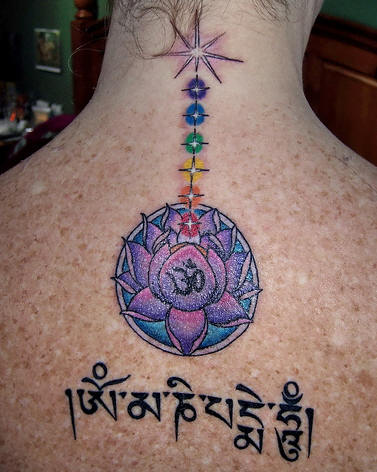 Lotus flower upper back tattoo