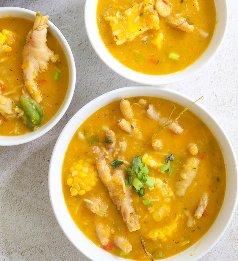 Multiple serving bowls of Jamaican chicken foot soup.
