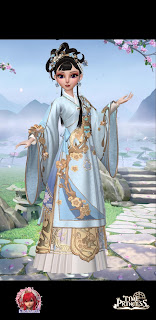 Lai in a formal baby blue robe with flowing golden accents and an elaborate hairstyle to match