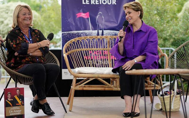 Grand Duchess Maria Teresa wore a purple oversized silk faille shirt by Valentino. Duchess wore black trousers, and black leather flats