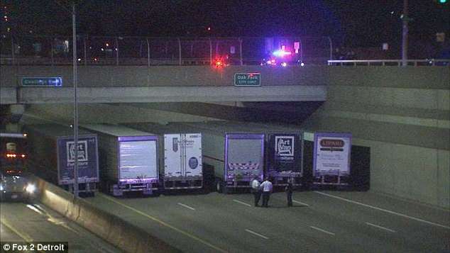 Police Trucks Parked Under A Bridge To Prevent A Man From Committing Suicide