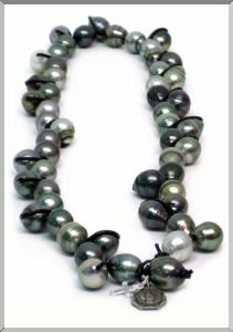 A stunning String of Black Tahitian Pearls