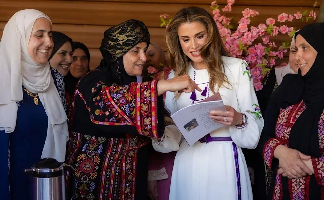 Queen Rania wore a floral embroidered midi dress by Giambattista Valli. Andrew Gn embellished dress