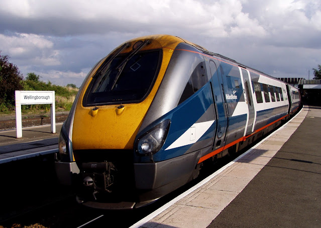 In Midland Mainline blue and white livery an unidentified Class 222 Meridian diesel electric multiple unit uk passenger train pauses in Wellingborough railway station before heading north 2000s