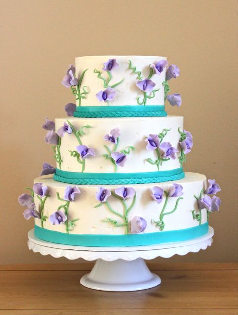 Their wedding colors were teal and purple It was a bright and very spring 