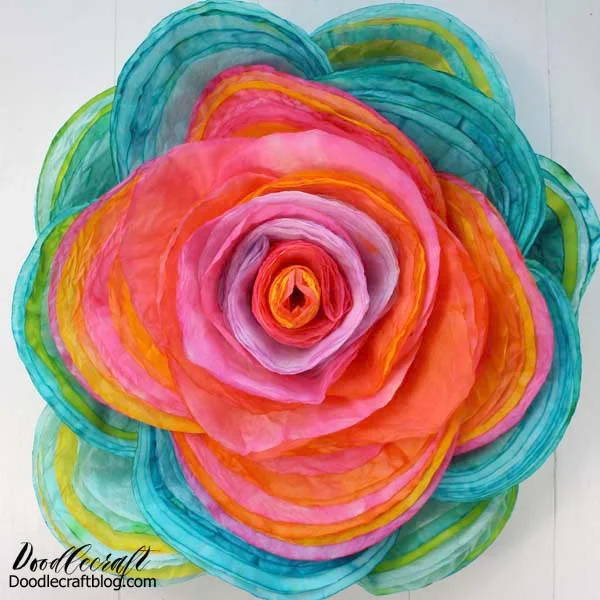 115 brightly colored layered coffee filters to make a giant 16 inch rose!